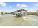 Entertaining rooftop deck featuring dining area beneath a pergola to gather with friends and Gathering at 5300 Peachtree Rd # 1608, Chamblee, GA 30341