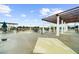 Spacious rooftop deck with dining seating and pergola offering an outdoor space to relax or entertain at 5300 Peachtree Rd # 1608, Chamblee, GA 30341