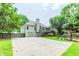 Backyard with a deck, stairs, a two-car garage, and playground area at 1122 Cayuga Ct, Dacula, GA 30019