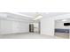 Finished basement space with updated lighting, flooring, and stainless refrigerator at 1122 Cayuga Ct, Dacula, GA 30019