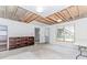 Partially finished basement with drywall, exposed ceiling, and bookshelf at 1122 Cayuga Ct, Dacula, GA 30019