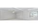 Spacious finished basement featuring recessed lighting and a bright window at 1122 Cayuga Ct, Dacula, GA 30019
