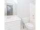 A bathroom with a single sink and toilet combination, as well as a shower to the right at 1122 Cayuga Ct, Dacula, GA 30019