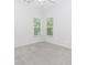 Bedroom with two windows offering natural light, carpeted floor, and neutral paint at 1122 Cayuga Ct, Dacula, GA 30019