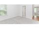 Bright bedroom with gray carpet and natural light from the window at 1122 Cayuga Ct, Dacula, GA 30019