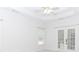Bedroom featuring a ceiling fan and French doors leading to the outdoor space at 1122 Cayuga Ct, Dacula, GA 30019