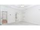 Spacious bedroom features a tray ceiling with ceiling fan, neutral walls, and plush carpeting at 1122 Cayuga Ct, Dacula, GA 30019