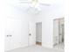 Bedroom featuring ceiling fan, double closets, and an en-suite bathroom at 1122 Cayuga Ct, Dacula, GA 30019