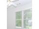 Bright bedroom with ceiling fan and natural light from two large windows at 1122 Cayuga Ct, Dacula, GA 30019