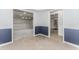 Open dining area with chandelier leads to kitchen with stainless steel refrigerator at 1122 Cayuga Ct, Dacula, GA 30019