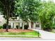 Charming single-story home featuring a stone-accented entrance and a well-manicured front lawn and driveway at 1122 Cayuga Ct, Dacula, GA 30019
