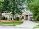 Charming one-story home with stone accents, manicured lawn and mature trees at 1122 Cayuga Ct, Dacula, GA 30019