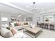 Spacious living room with neutral decor, hardwood floors, and recessed lighting at 1122 Cayuga Ct, Dacula, GA 30019