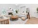 Inviting living room with a fireplace, built-in shelves, and lots of natural light at 1122 Cayuga Ct, Dacula, GA 30019