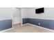 Cozy living room with chair rail, neutral paint, and television at 1122 Cayuga Ct, Dacula, GA 30019