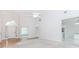 Bright living room features large windows, vaulted ceilings, and entryways with hardwood floors at 1122 Cayuga Ct, Dacula, GA 30019