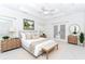 Bright main bedroom with a trey ceiling, neutral decor, and an ensuite at 1122 Cayuga Ct, Dacula, GA 30019