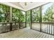 Relax on the screened porch overlooking the backyard, perfect for enjoying the outdoors at 1122 Cayuga Ct, Dacula, GA 30019