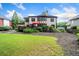Backyard with lawn, landscaping, and deck with an umbrella at 3438 Winborn Walk Northwest Nw, Kennesaw, GA 30152