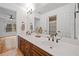 Bathroom with double sinks, stylish fixtures, and a large mirror, providing a sleek and modern feel at 3438 Winborn Walk Northwest Nw, Kennesaw, GA 30152