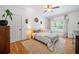 Bedroom featuring a natural light, hardwood floors, and a cozy rug at 3438 Winborn Walk Northwest Nw, Kennesaw, GA 30152
