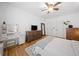 Bedroom featuring a dresser, a makeup table, and hardwood floors at 3438 Winborn Walk Northwest Nw, Kennesaw, GA 30152