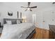 Bedroom features hardwood floors, modern decor, and natural light at 3438 Winborn Walk Northwest Nw, Kennesaw, GA 30152