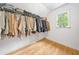 Walk-in closet includes hardwood floors, a window and plenty of rack storage at 3438 Winborn Walk Northwest Nw, Kennesaw, GA 30152