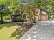 Front exterior with a large driveway and landscaped front yard at 3438 Winborn Walk Northwest Nw, Kennesaw, GA 30152