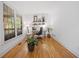 Bright office space featuring hardwood floors, a large window, and modern decor for a productive work environment at 3438 Winborn Walk Northwest Nw, Kennesaw, GA 30152