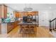 Kitchen with wood cabinets, kitchen island and stainless steel appliances at 3438 Winborn Walk Northwest Nw, Kennesaw, GA 30152