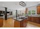 Open kitchen with dark granite island and stainless steel appliances at 3438 Winborn Walk Northwest Nw, Kennesaw, GA 30152