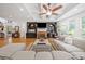 Spacious living room with hardwood floors, custom built-ins, a fireplace, and abundant natural light at 3438 Winborn Walk Northwest Nw, Kennesaw, GA 30152