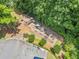 Aerial view of a playground surrounded by trees and a parking lot at 3438 Winborn Walk Northwest Nw, Kennesaw, GA 30152