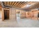 Spacious unfinished basement featuring concrete floors and exposed wood ceiling, ready for customization at 1488 White Columns Blvd, Canton, GA 30115