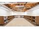 An unfinished basement with open ceilings and utility fixtures provides potential for customization at 1488 White Columns Blvd, Canton, GA 30115
