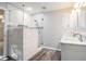 Beautiful bathroom featuring a tile shower, glass door and double sink vanity with marble countertop at 1488 White Columns Blvd, Canton, GA 30115