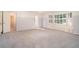 Spacious bedroom with large windows, built-in cabinets and neutral carpet perfect for relaxation at 1488 White Columns Blvd, Canton, GA 30115