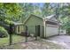 Side view of home featuring a secure fenced-in yard and a two-car garage at 1488 White Columns Blvd, Canton, GA 30115