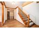 Entryway with wooden staircase, hardwood floors, and views into the adjacent living spaces at 1488 White Columns Blvd, Canton, GA 30115