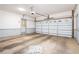 A spacious garage with a white garage door and side entrance, offering ample parking and storage space at 1488 White Columns Blvd, Canton, GA 30115