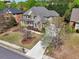 Charming two-story home with brick and siding, a welcoming front porch, and a well-maintained lawn at 1754 Water Springs Way, Dacula, GA 30019