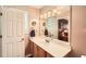 Clean bathroom with neutral walls, single sink vanity, toilet, and large vanity mirror at 181 Weatherstone Dr, Woodstock, GA 30188