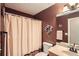 Bathroom with single sink vanity, toilet, shower and neutral walls and decor at 181 Weatherstone Dr, Woodstock, GA 30188