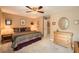 Comfortable bedroom with carpeted floors, neutral colored walls, ceiling fan and closet at 181 Weatherstone Dr, Woodstock, GA 30188