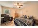 Comfortable bedroom with carpeted floors, light colored walls, ceiling fan and closet at 181 Weatherstone Dr, Woodstock, GA 30188