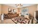 Spacious bedroom features a comfy daybed, plush sofa, and colorful area rug at 181 Weatherstone Dr, Woodstock, GA 30188