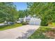 A two-story home features a lush green lawn and ample driveway space for parking at 181 Weatherstone Dr, Woodstock, GA 30188