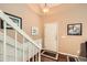 Inviting home foyer with hardwood floors, staircase, and stylish decor at 181 Weatherstone Dr, Woodstock, GA 30188