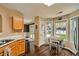 Bright eat-in kitchen features wood floors, a bay window, and outdoor views at 181 Weatherstone Dr, Woodstock, GA 30188